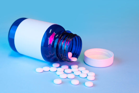 Image shows a spilled vial of benzodiazepine drugs, cover image for a blog about why you should test for benzodiazepines abuse at work/home